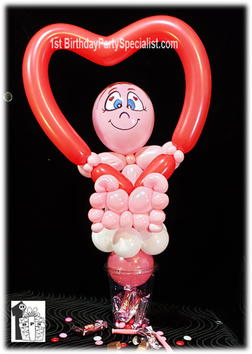 Valentine's Day Candy Cups - person holding a valentine's day balloon heart.